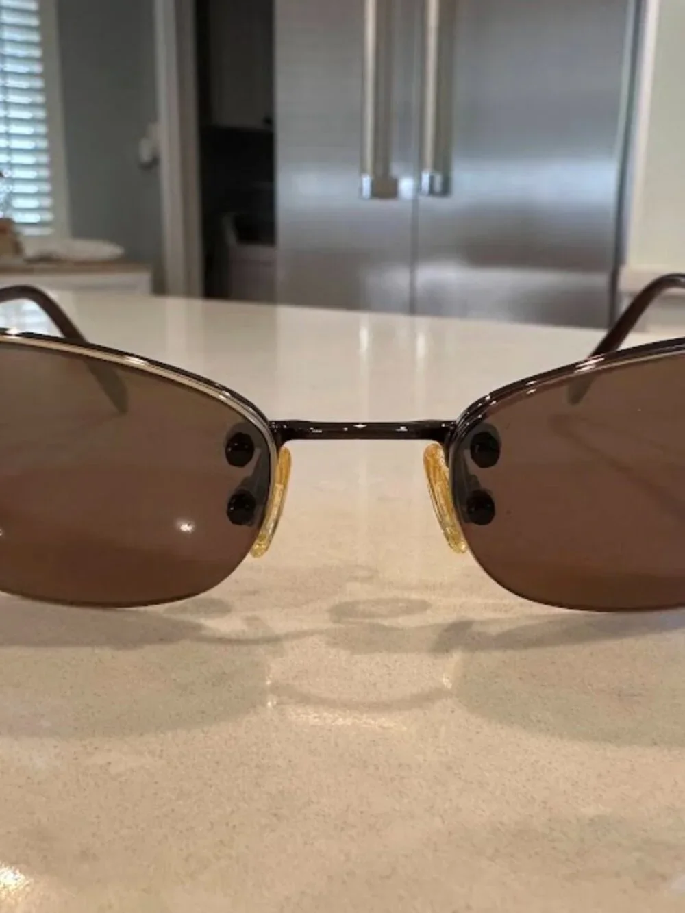 Maui Jim Brown Lens Oval Sunglasses with Gold Nose Pads and Dark Brown Frame